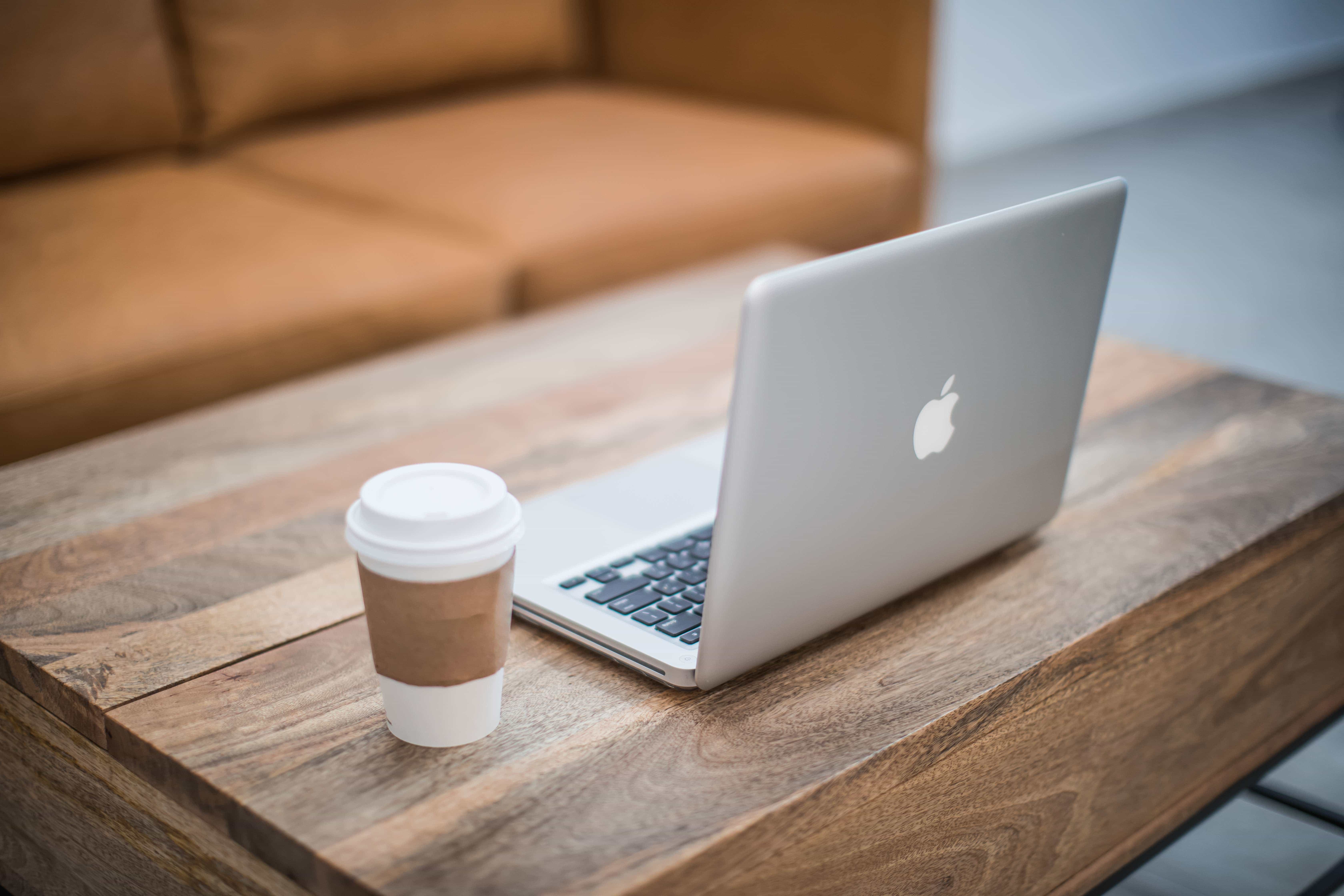 Lounge desk with a MacBook Pro on top